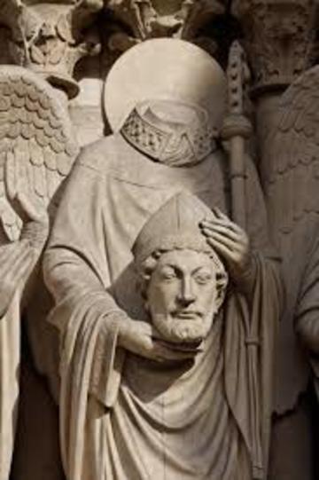 Architectural sculpture showing saint Denis holding his severed head 